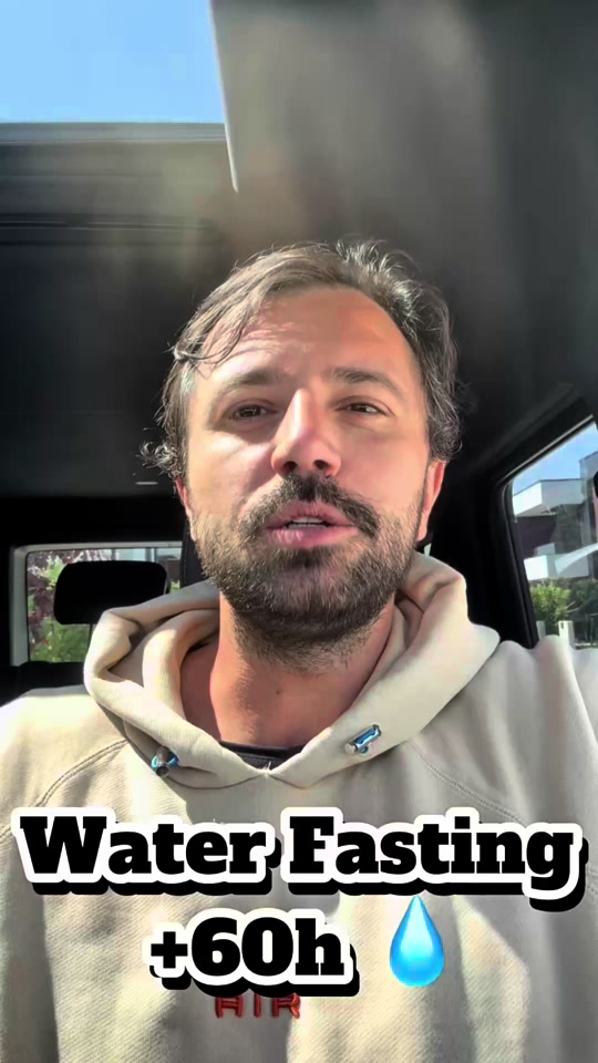 Eduard wearing a hoodie inside a car, with the original “Water Fasting +60h” text on the video.