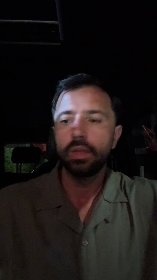 Eduard speaking from a car in the original video discussing cancer and biopsies.