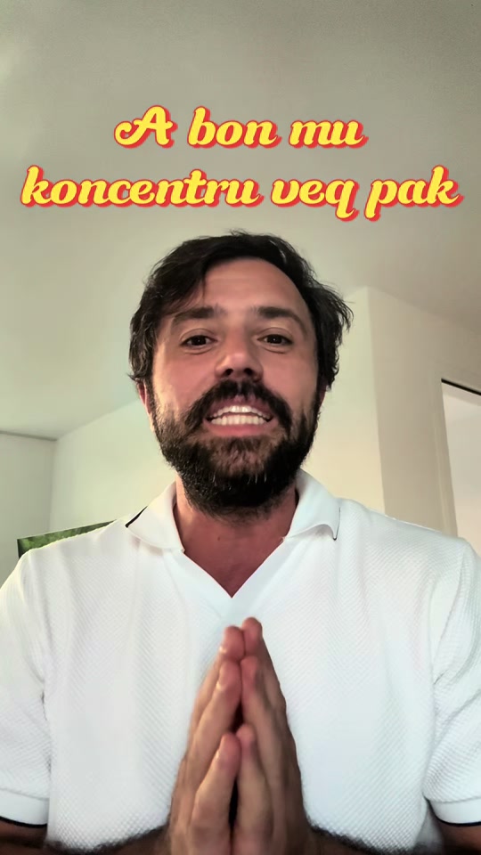 Eduard Luta in a white polo with his hands together beneath an Albanian caption asking for a little focus.