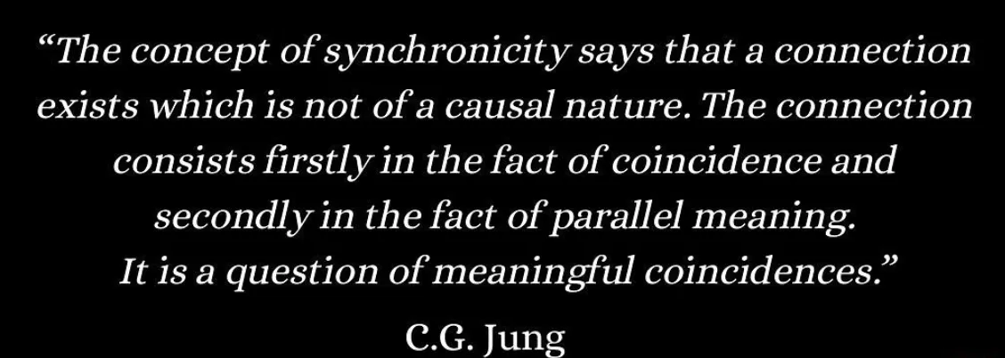 Jung quote defining synchronicity as meaningful coincidence, white text on black