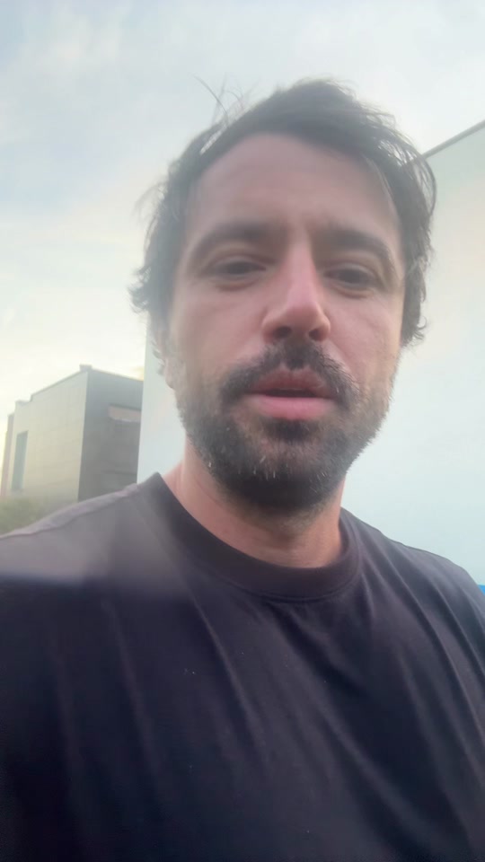 Eduard outdoors in a dark shirt in the original video about talent and work.