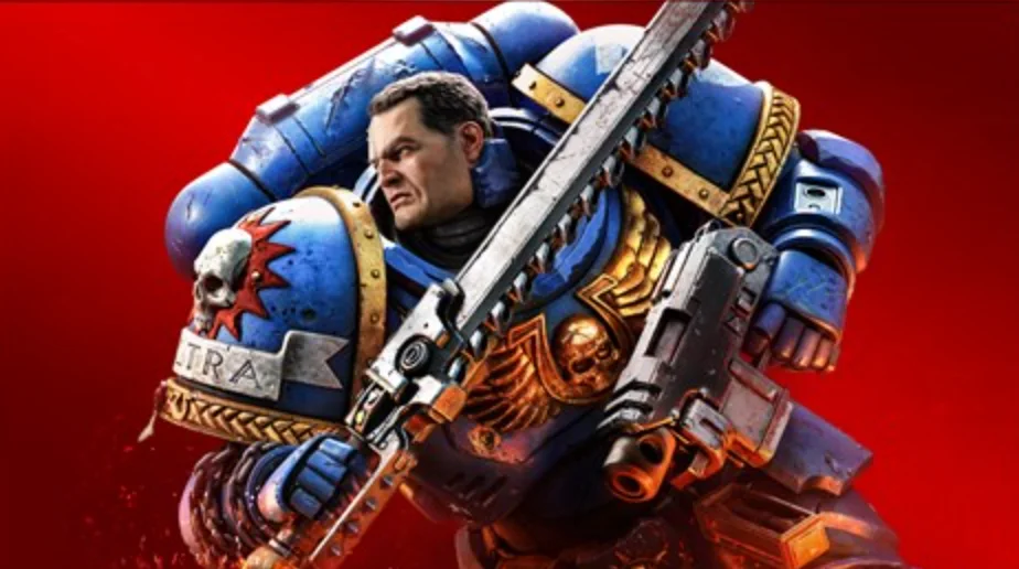An Ultramarine Space Marine in blue and gold power armour carrying a chainsword and bolt pistol